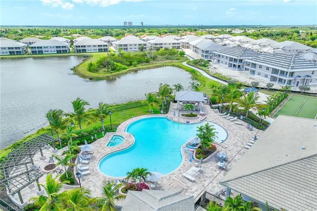 a view of a swimming pool with a yard