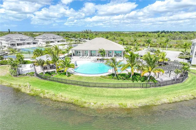 a view of a swimming pool with a yard