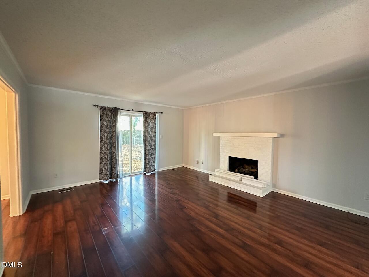 3717 Sue Ellen Drive Raleigh, NC 27604 - Photo 11 of 20 a view of an empty room with wooden floor and a window