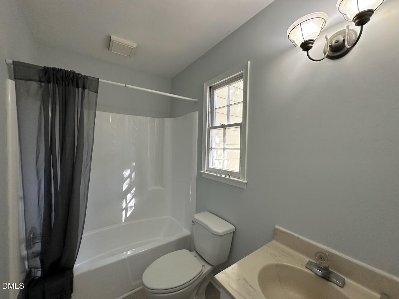 3717 Sue Ellen Drive Raleigh, NC 27604 - Photo 12 of 20 a bathroom with a sink a toilet and shower