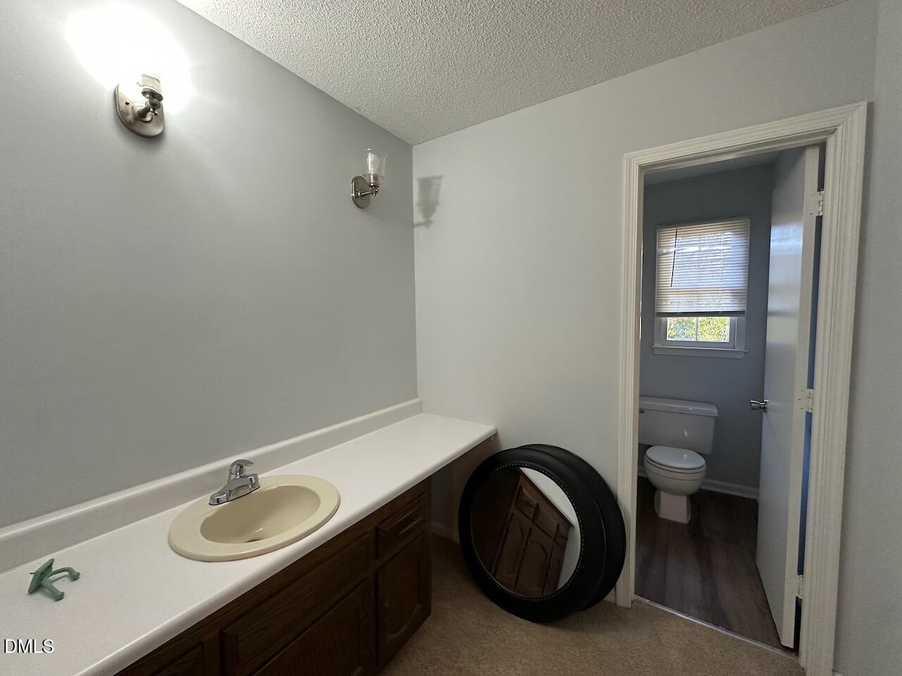3717 Sue Ellen Drive Raleigh, NC 27604 - Photo 14 of 20 a bathroom with a sink and a toilet