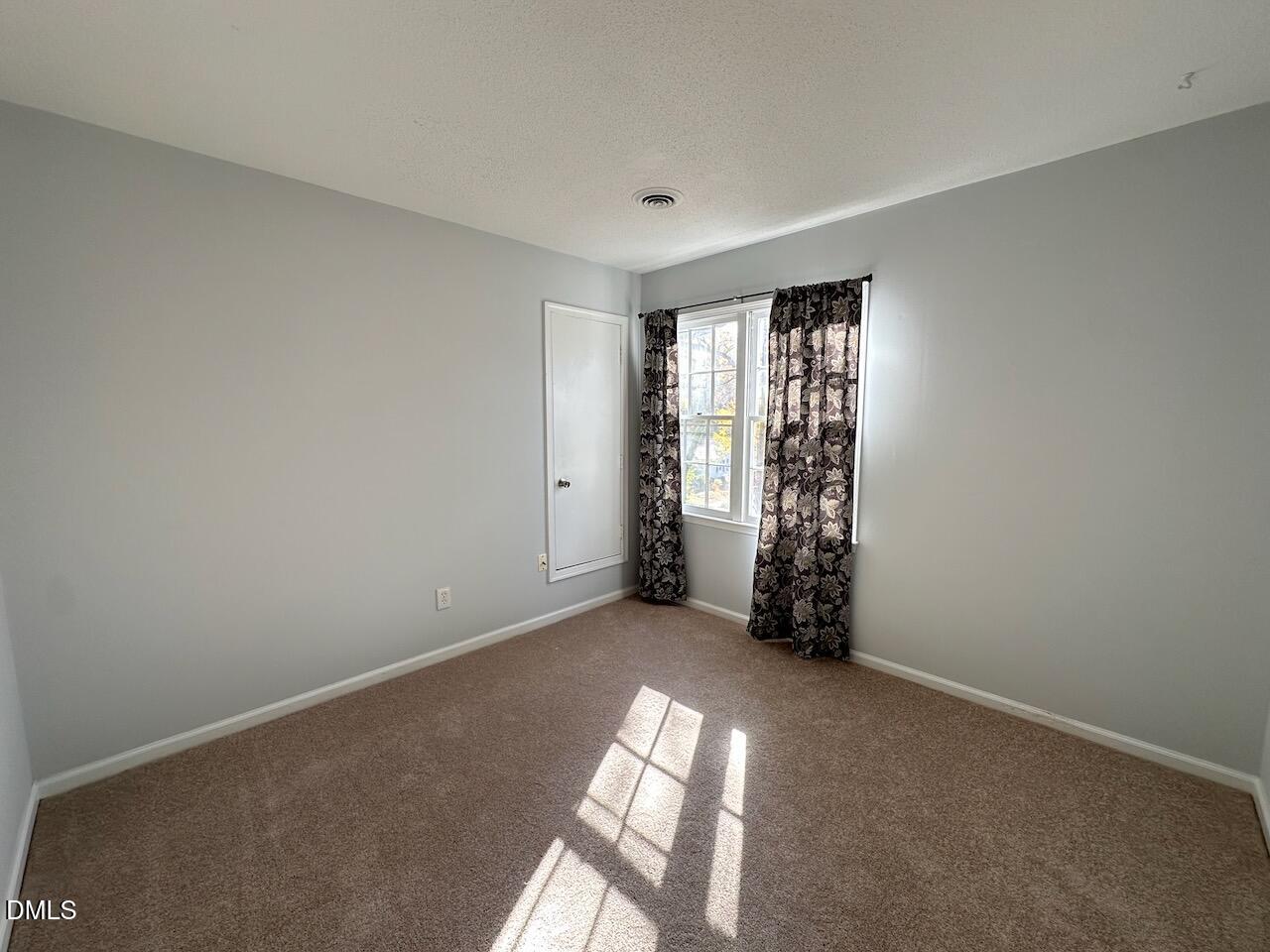 3717 Sue Ellen Drive Raleigh, NC 27604 - Photo 18 of 20 an empty room with windows