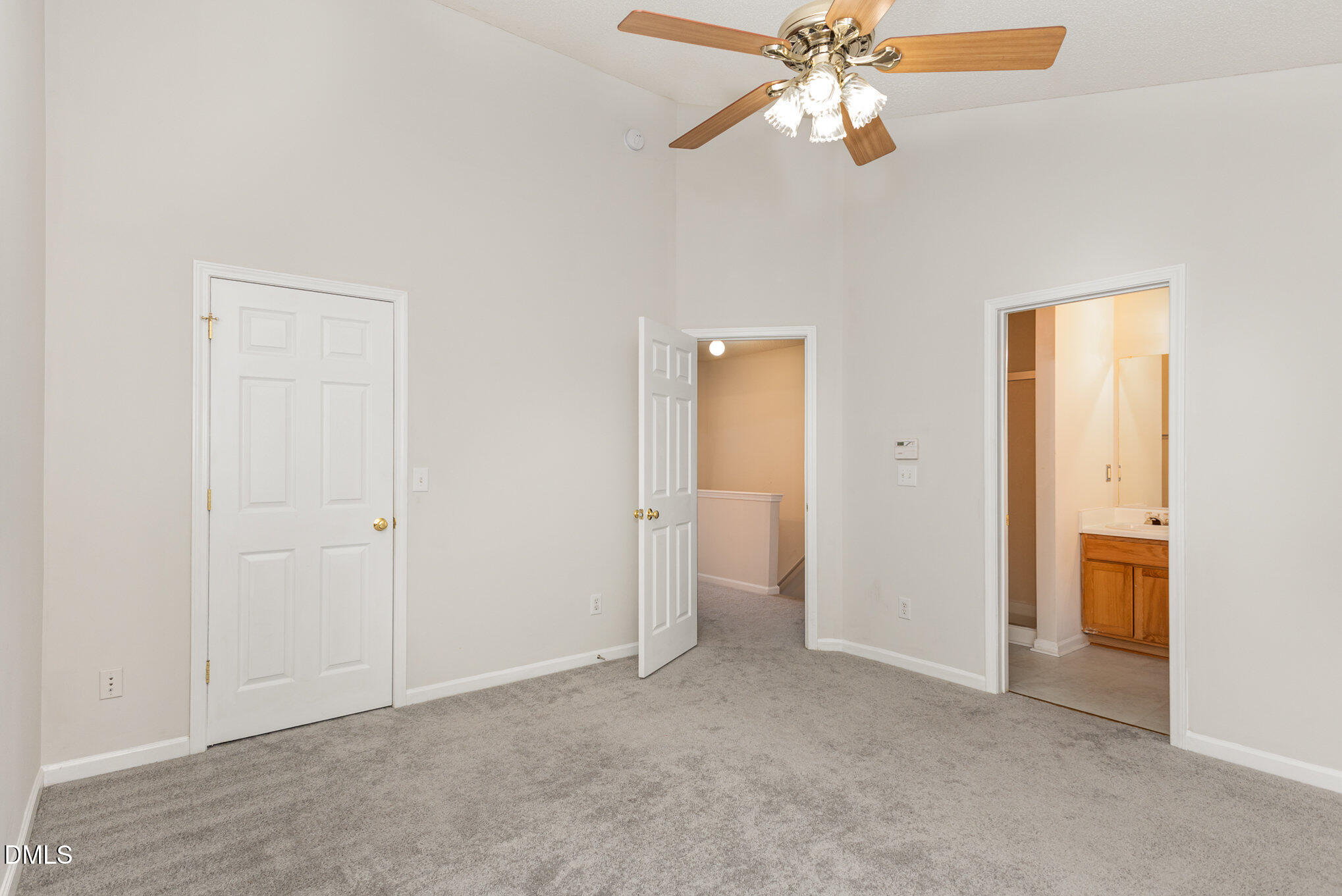 10947 Pendragon Place Raleigh, NC 27614 - Photo 12 of 21 an empty room with closet and a ceiling fan