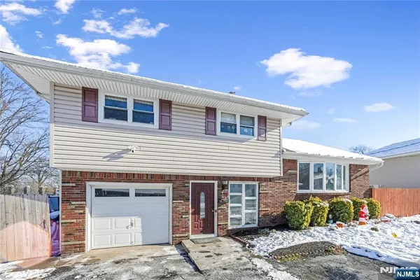 a front view of a house with a garage