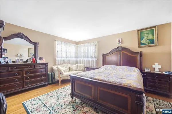 a bed room with a bed and a mirror