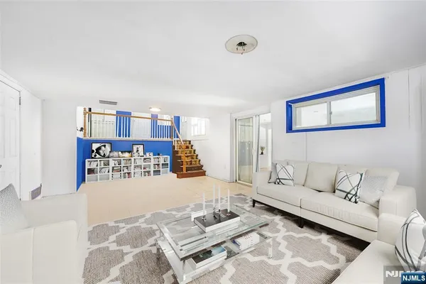 a living room with furniture and rug