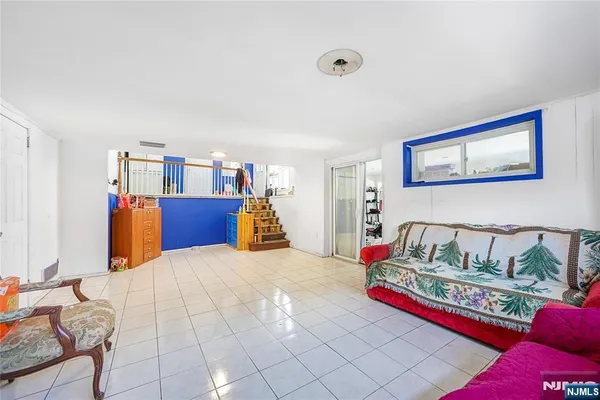 a bedroom with furniture and a book shelf