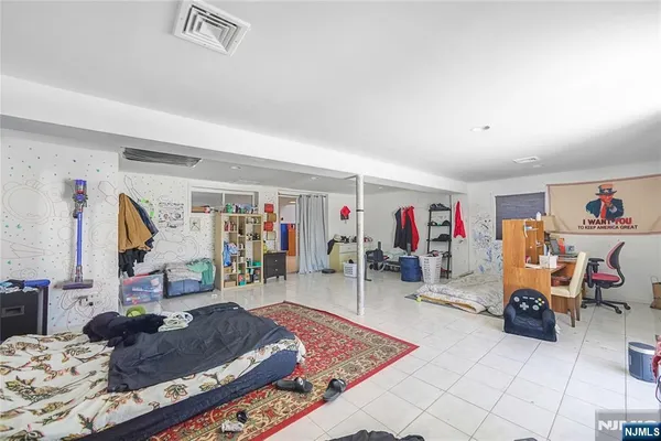 a living room with lots of furniture and a wooden floor