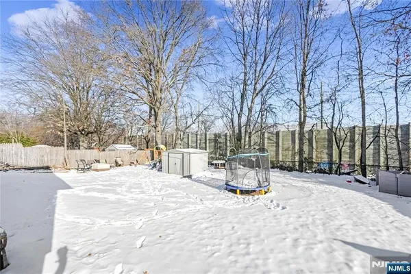 a wooden bench sitting in middle of snow