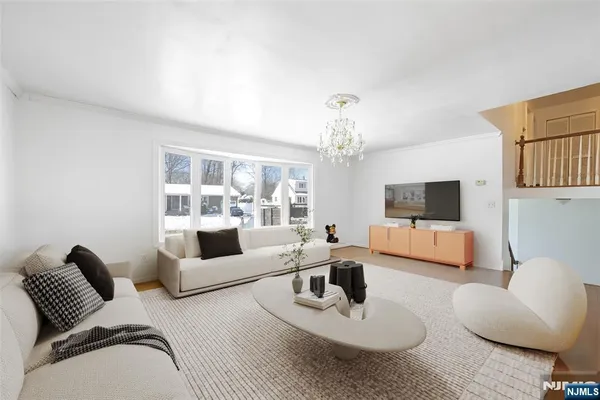 a living room with furniture or couch and a flat screen tv