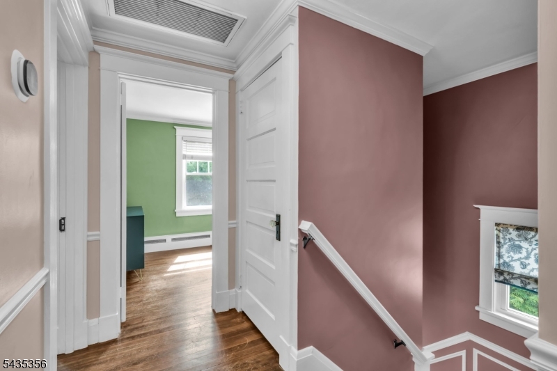 105 Somerville Road Bedminster, NJ 07921 - Photo 13 of 36 a view of a hallway with wooden floor and stairs