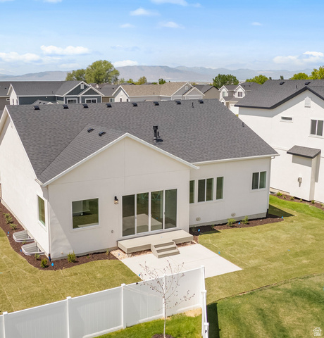 43 South Crimson Way, Unit 311 Mapleton, UT 84664 - Photo 27 of 28 Contemporary rear exterior featuring multiple window placements, a sliding glass door, and a concrete patio