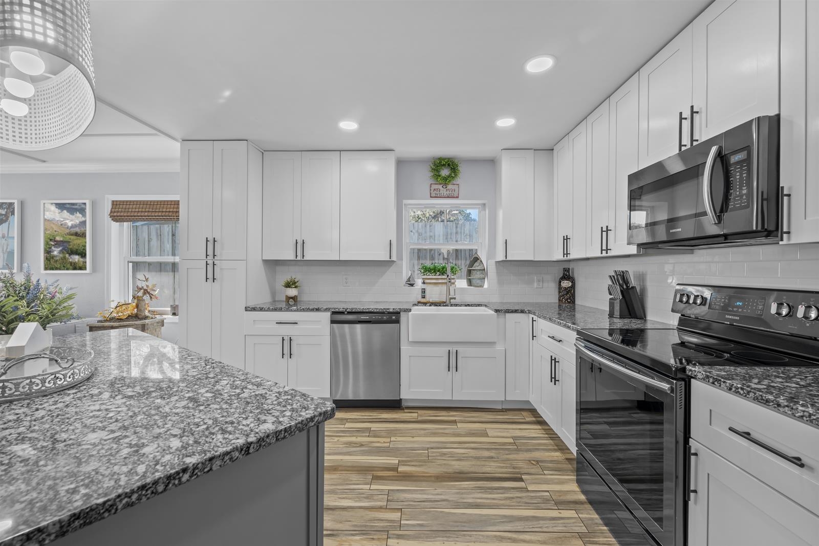 130 Cedar Creek Road Palatka, FL 32177 - Photo 11 of 73 a kitchen with stainless steel appliances granite countertop a sink stove microwave and cabinets