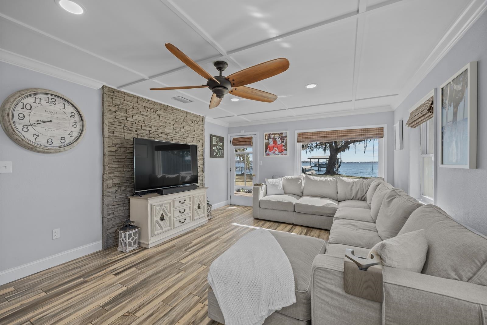 130 Cedar Creek Road Palatka, FL 32177 - Photo 15 of 73 a living room with furniture a flat screen tv and a fireplace