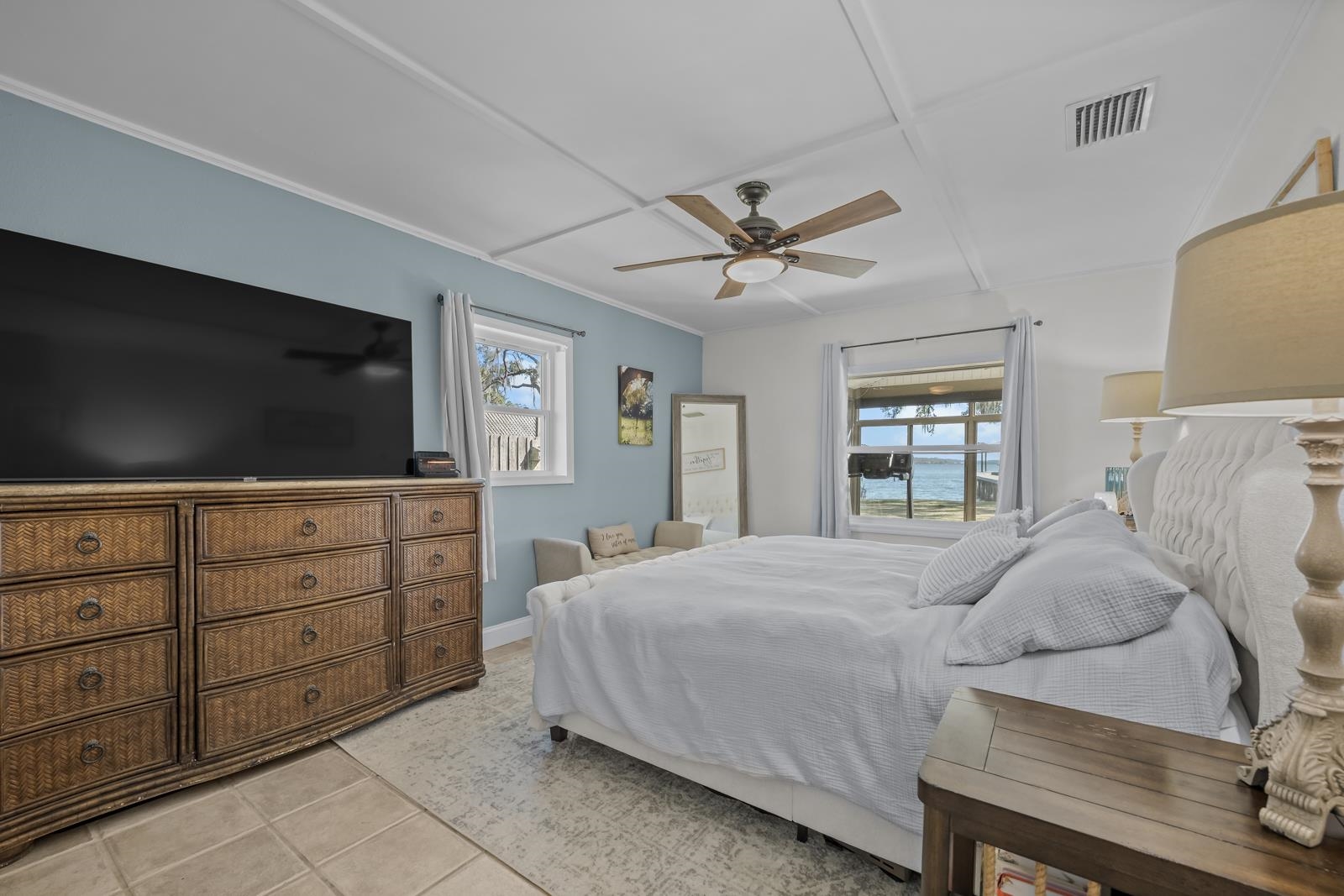 130 Cedar Creek Road Palatka, FL 32177 - Photo 16 of 73 a bedroom with a bed and a flat screen tv