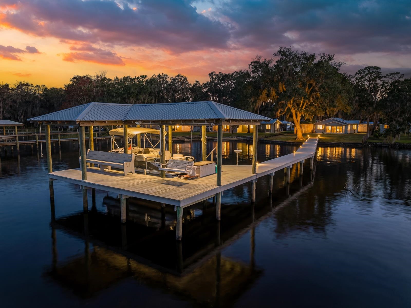130 Cedar Creek Road Palatka, FL 32177 - Photo 2 of 73 a view of a balcony with two chairs and a table