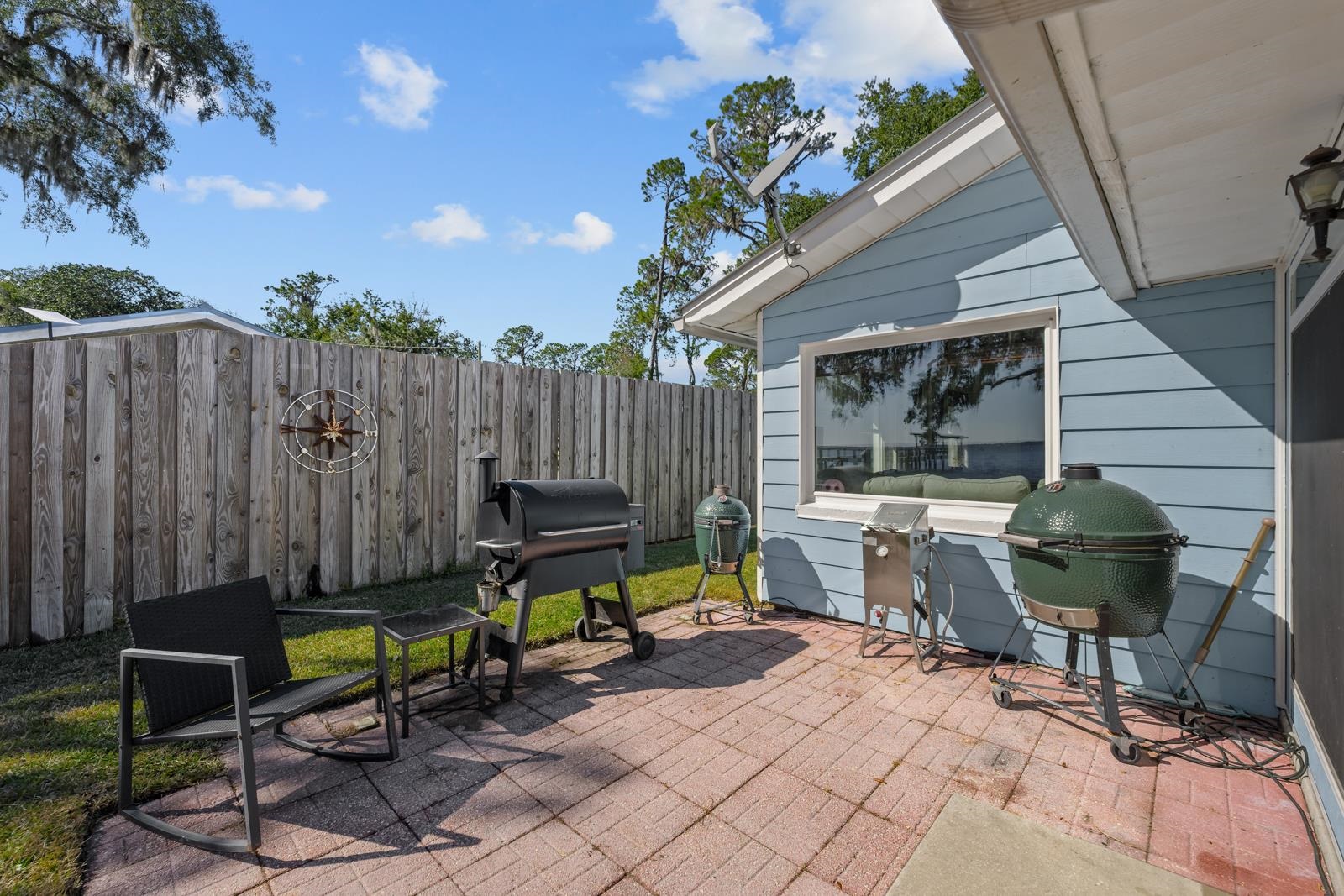 130 Cedar Creek Road Palatka, FL 32177 - Photo 24 of 73 a view of backyard with a table and chairs