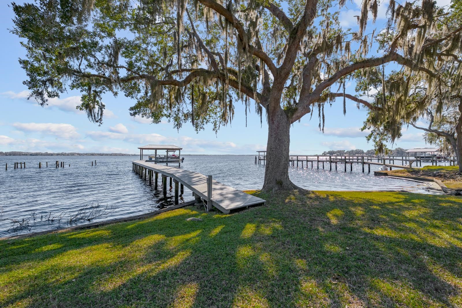 130 Cedar Creek Road Palatka, FL 32177 - Photo 28 of 73 a view of a swimming pool with deck and a garden