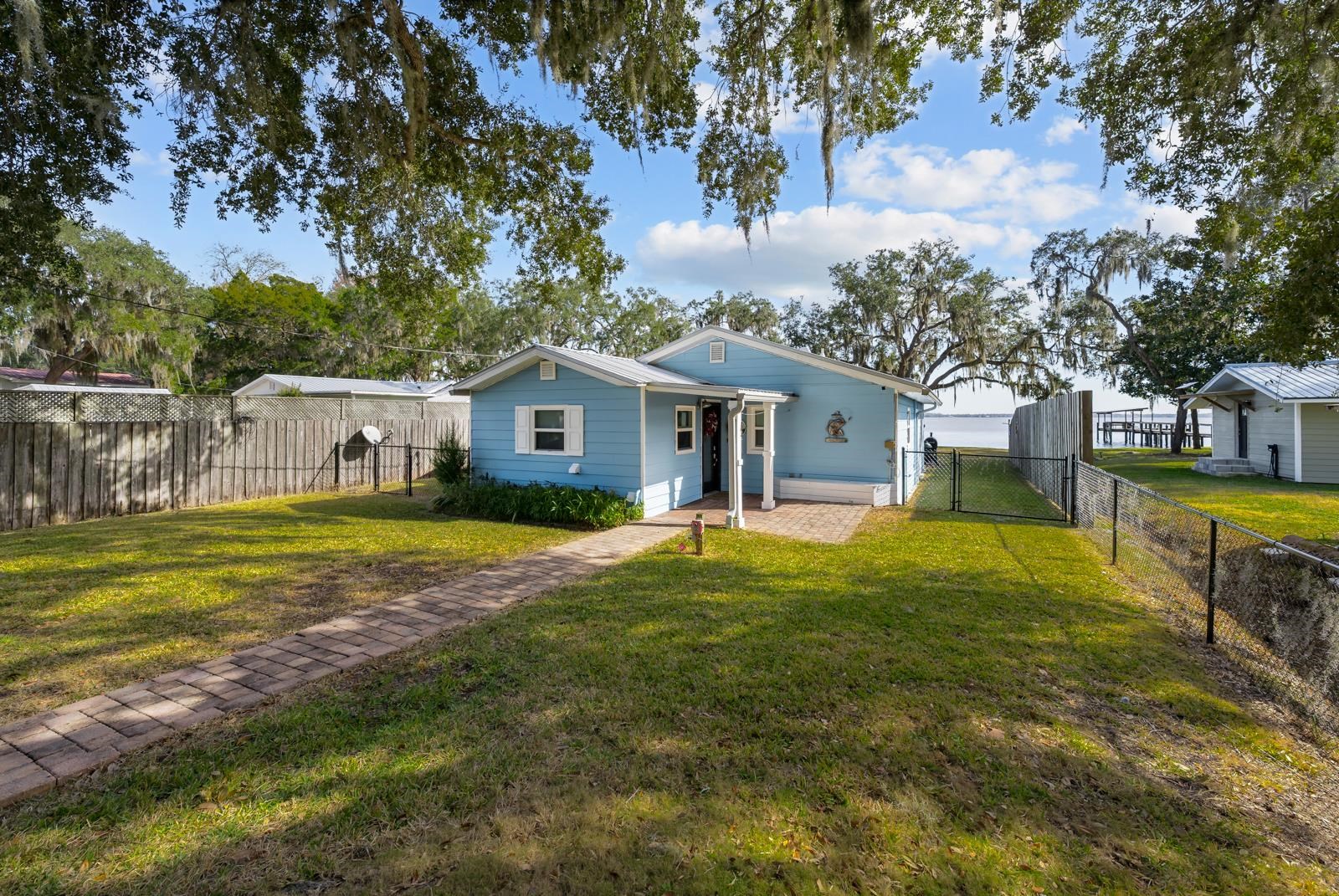 130 Cedar Creek Road Palatka, FL 32177 - Photo 3 of 73 a view of a house with a big yard and large trees