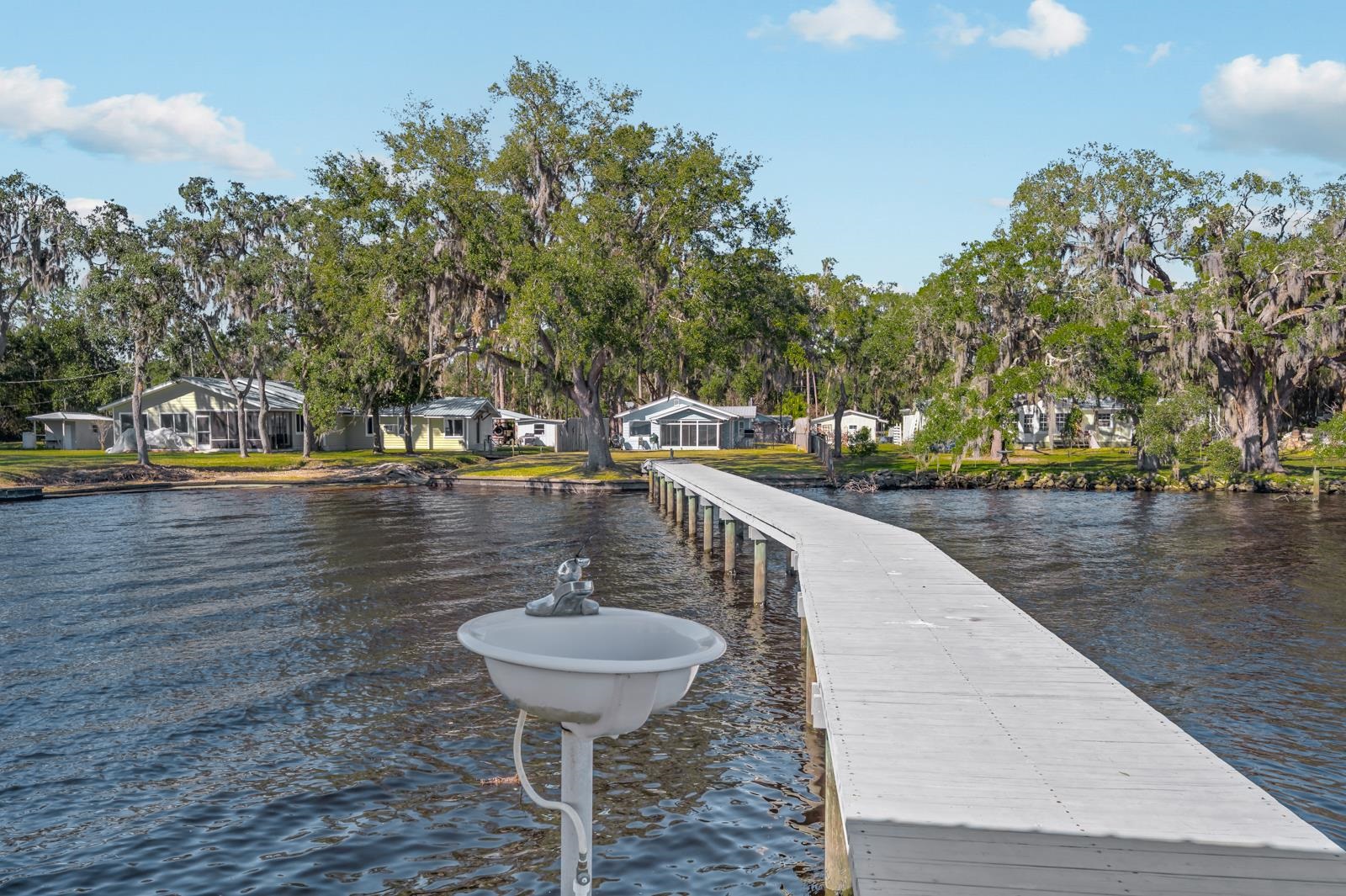 130 Cedar Creek Road Palatka, FL 32177 - Photo 37 of 73 Dock area featuring a residential view and a water view