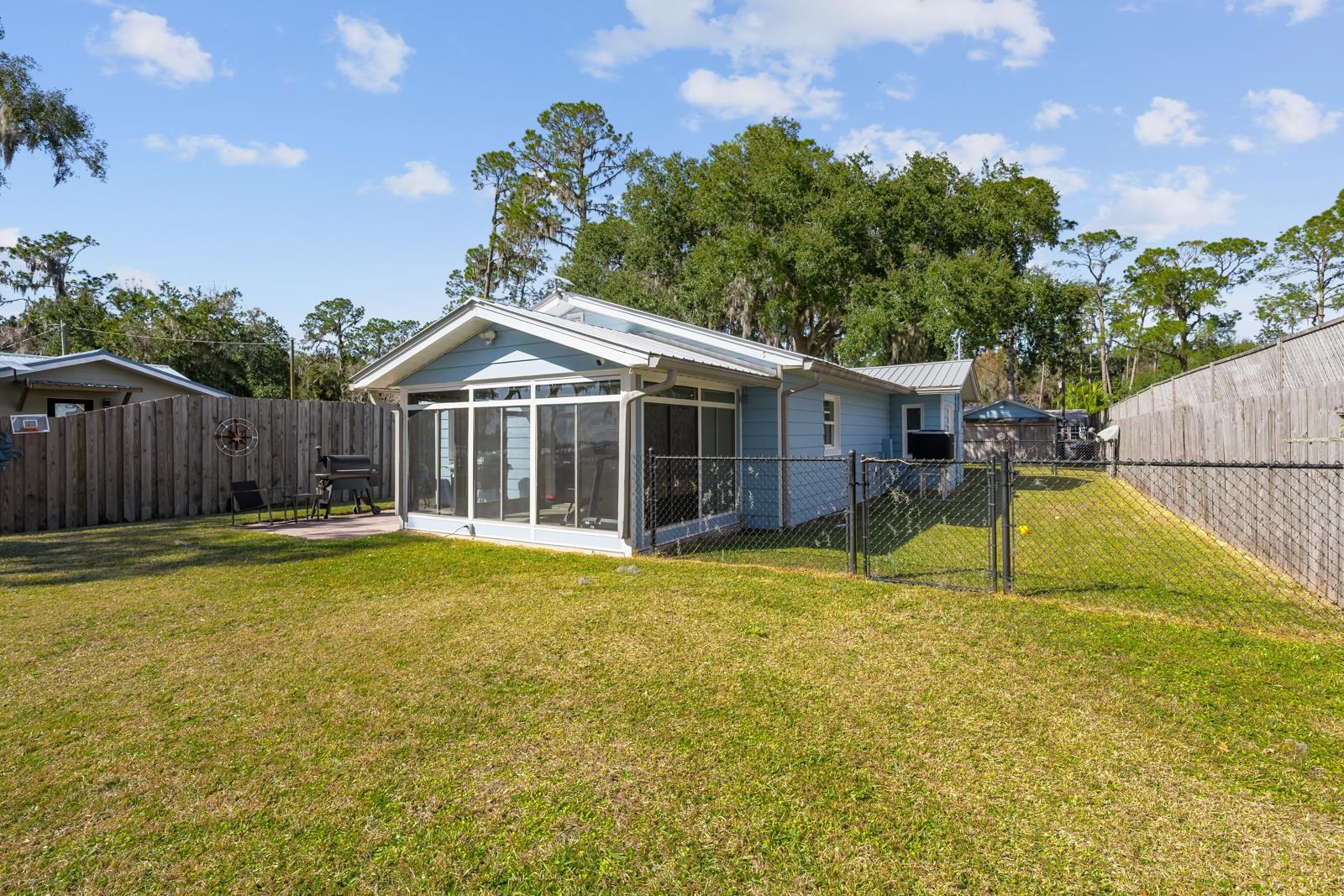 130 Cedar Creek Road Palatka, FL 32177 - Photo 40 of 73 a white house with a large pool in front of it