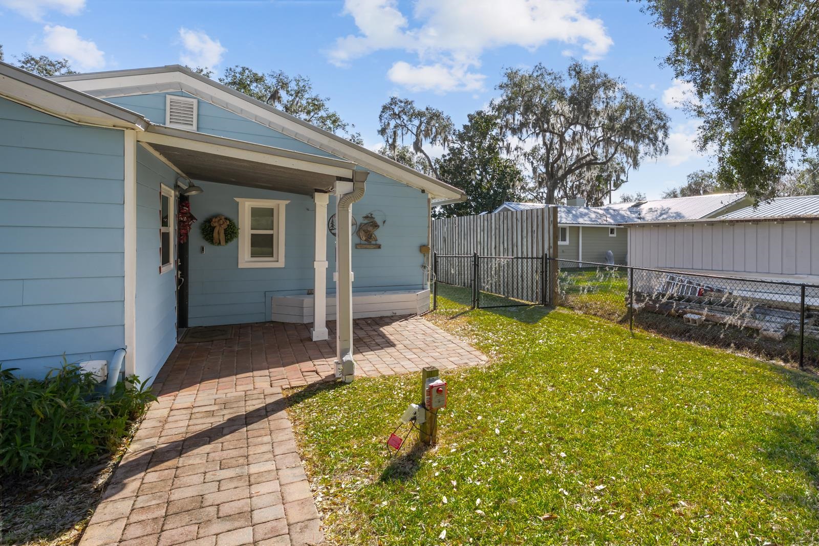 130 Cedar Creek Road Palatka, FL 32177 - Photo 4 of 73 View of yard with a patio