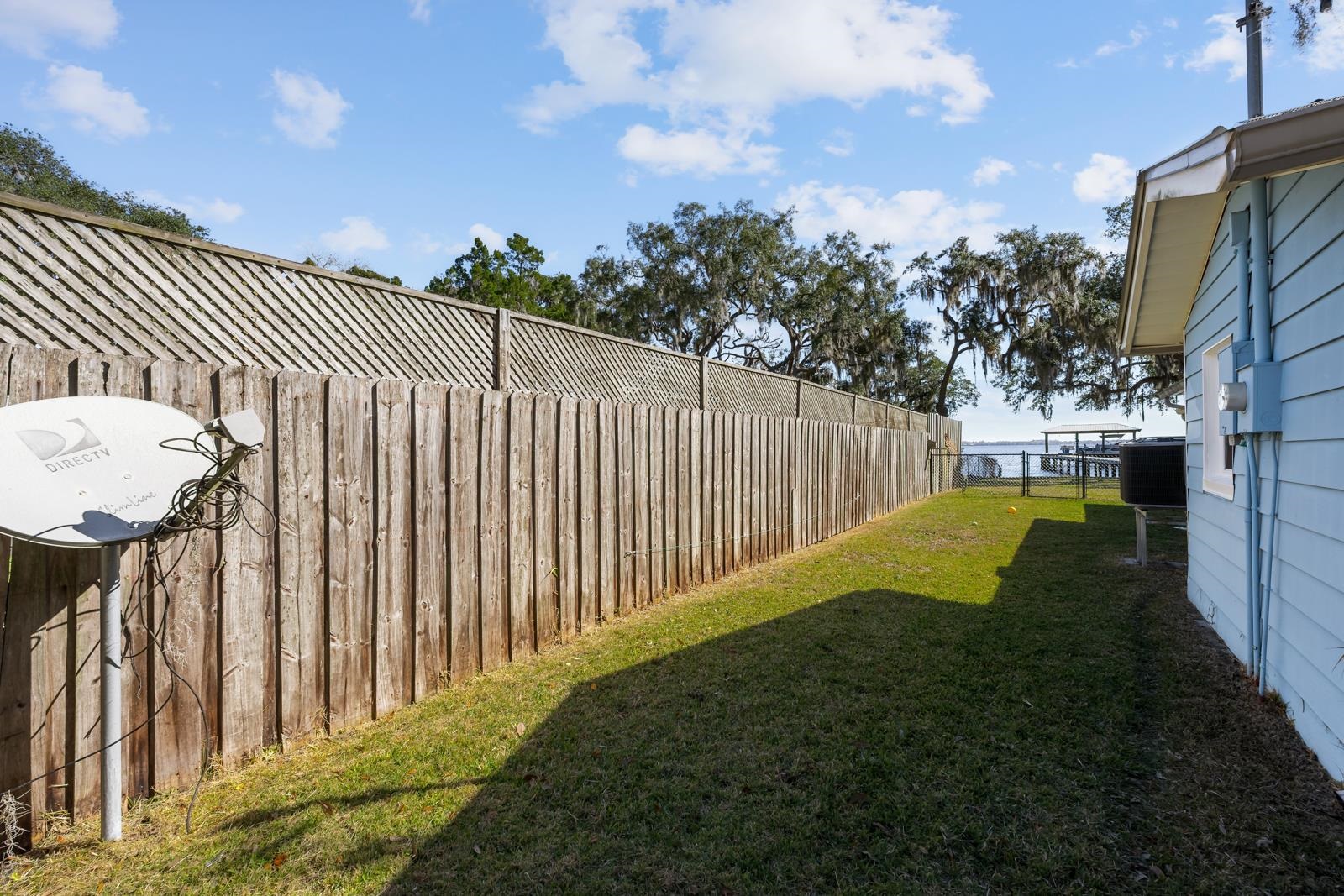 130 Cedar Creek Road Palatka, FL 32177 - Photo 41 of 73 a view of a backyard with wooden fence