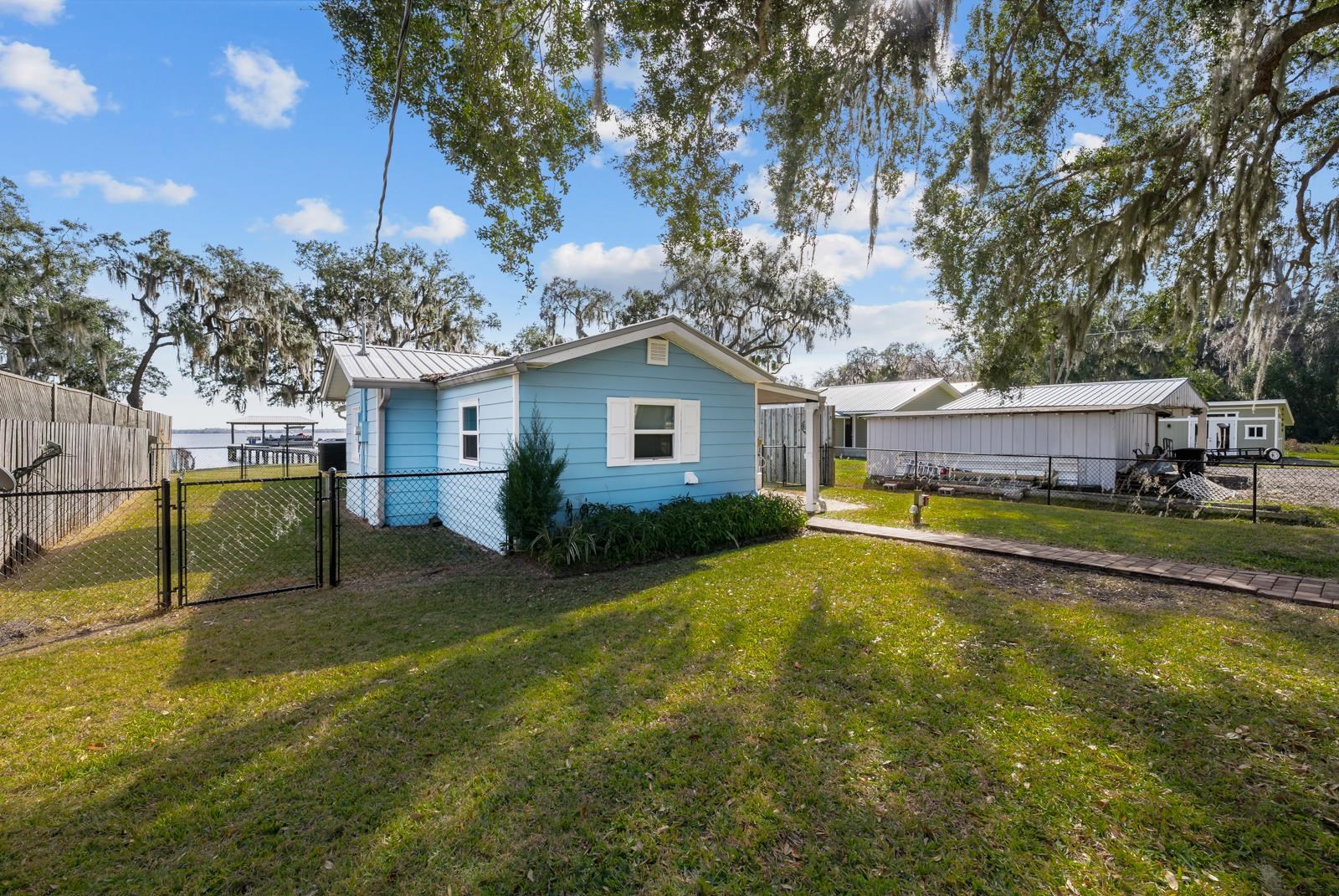 130 Cedar Creek Road Palatka, FL 32177 - Photo 43 of 73 a view of a house with pool and a yard