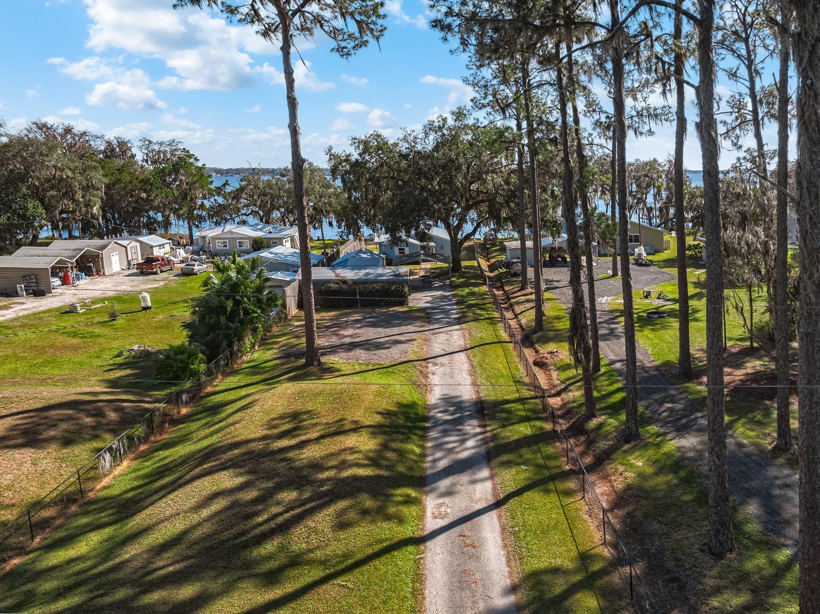 130 Cedar Creek Road Palatka, FL 32177 - Photo 59 of 73 a view of a swimming pool with a lawn chairs and lake view