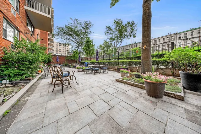 a view of a patio with couches and potted plants