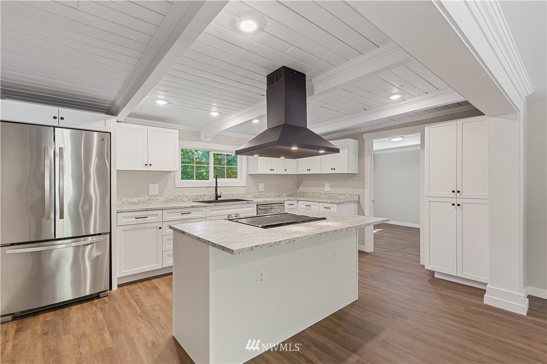 17610 Blodgett Road Mount Vernon, WA 98274 - Photo 11 of 30 a kitchen with a sink stainless steel appliances and wooden floor