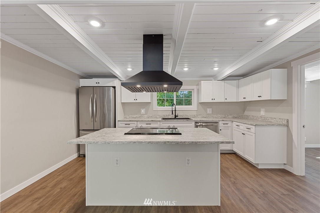 17610 Blodgett Road Mount Vernon, WA 98274 - Photo 12 of 30 a kitchen with granite countertop a sink stainless steel appliances and cabinets
