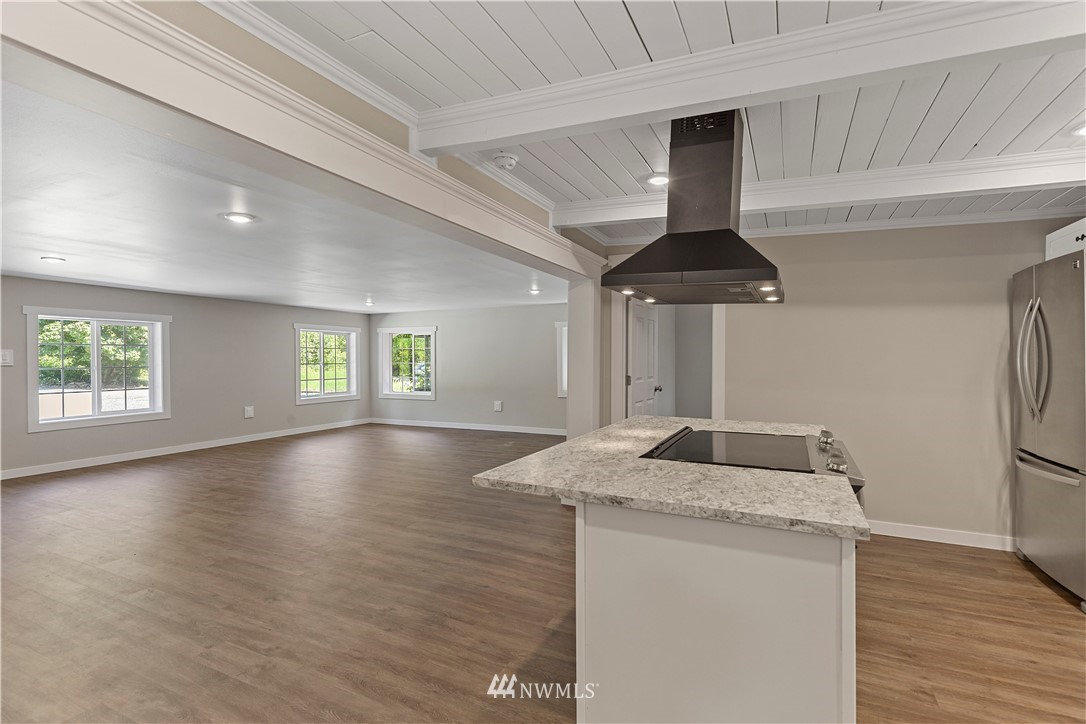 17610 Blodgett Road Mount Vernon, WA 98274 - Photo 13 of 30 a kitchen with granite countertop a sink and a refrigerator