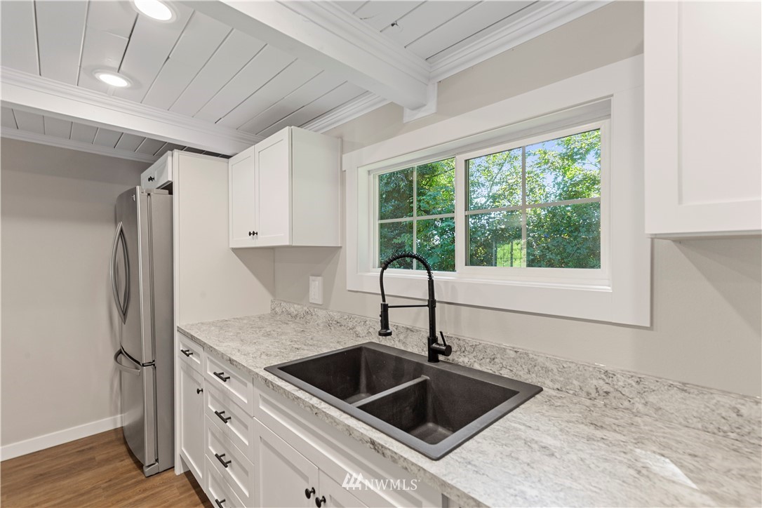 17610 Blodgett Road Mount Vernon, WA 98274 - Photo 15 of 30 a kitchen with granite countertop a sink and a window