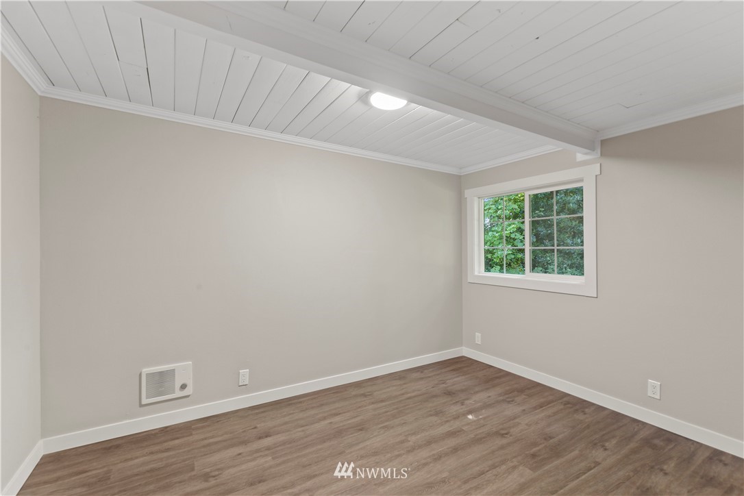 17610 Blodgett Road Mount Vernon, WA 98274 - Photo 17 of 30 a view of an empty room with wooden floor and a window