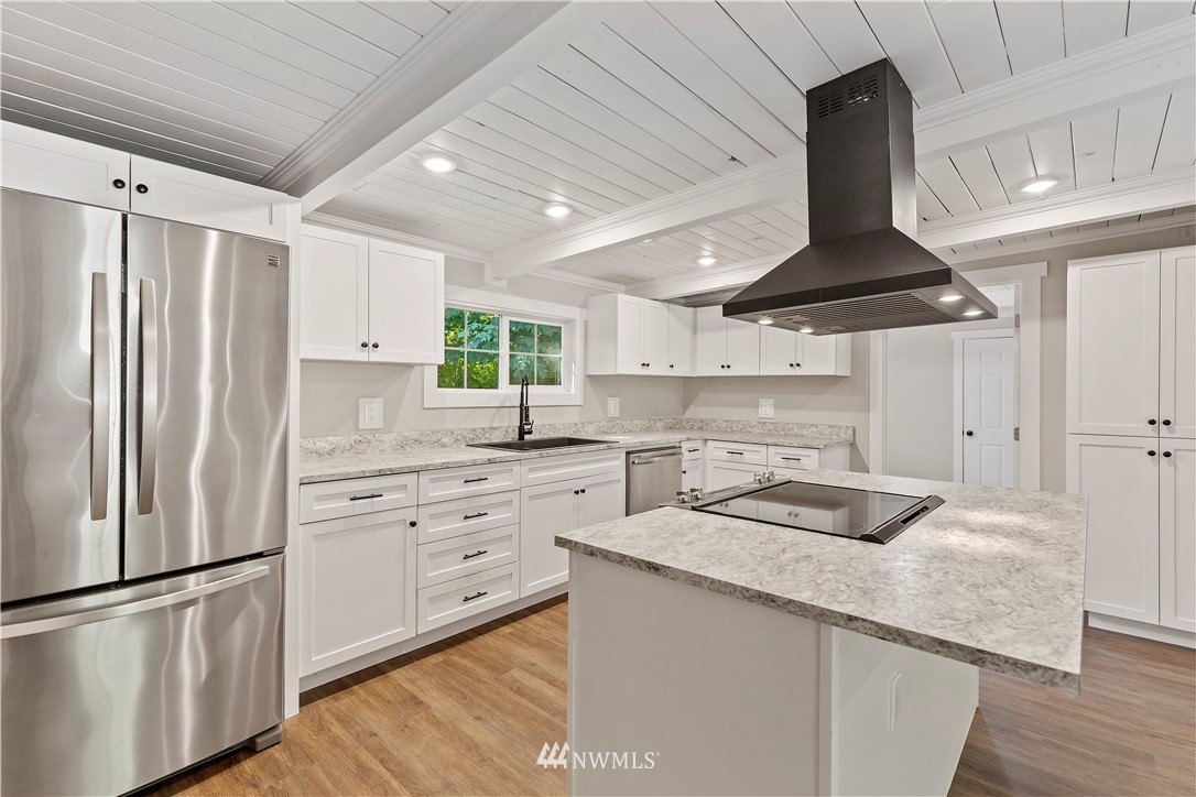 17610 Blodgett Road Mount Vernon, WA 98274 - Photo 18 of 30 a kitchen with granite countertop a sink stainless steel appliances and cabinets