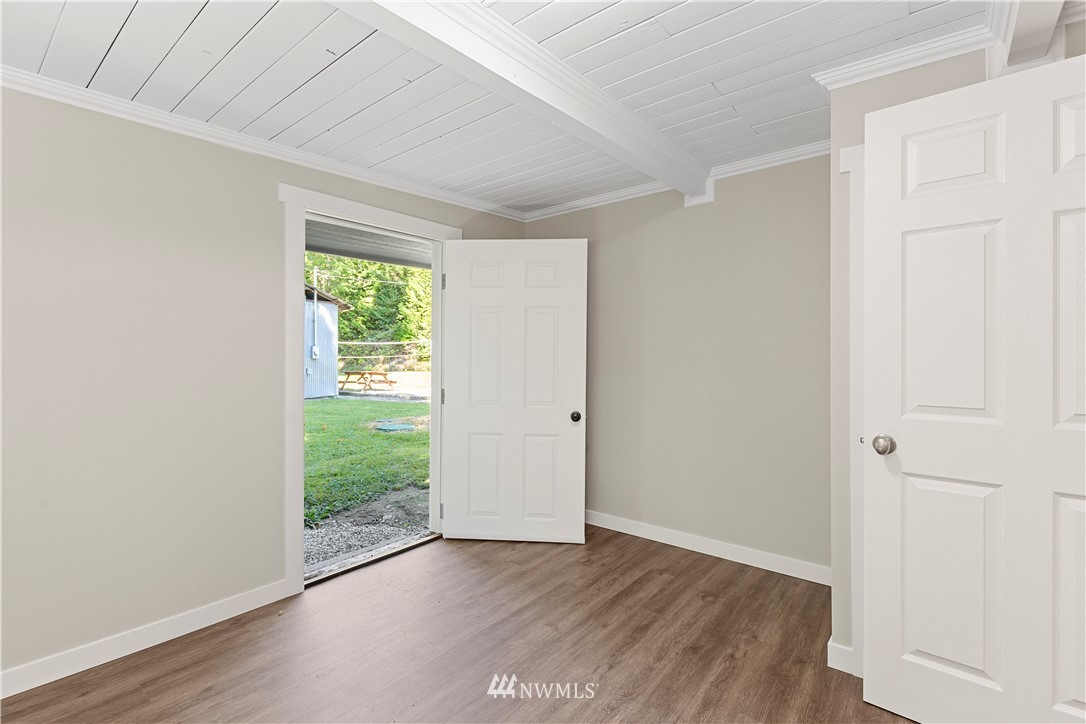 17610 Blodgett Road Mount Vernon, WA 98274 - Photo 21 of 30 a view of an empty room with wooden floor and a window