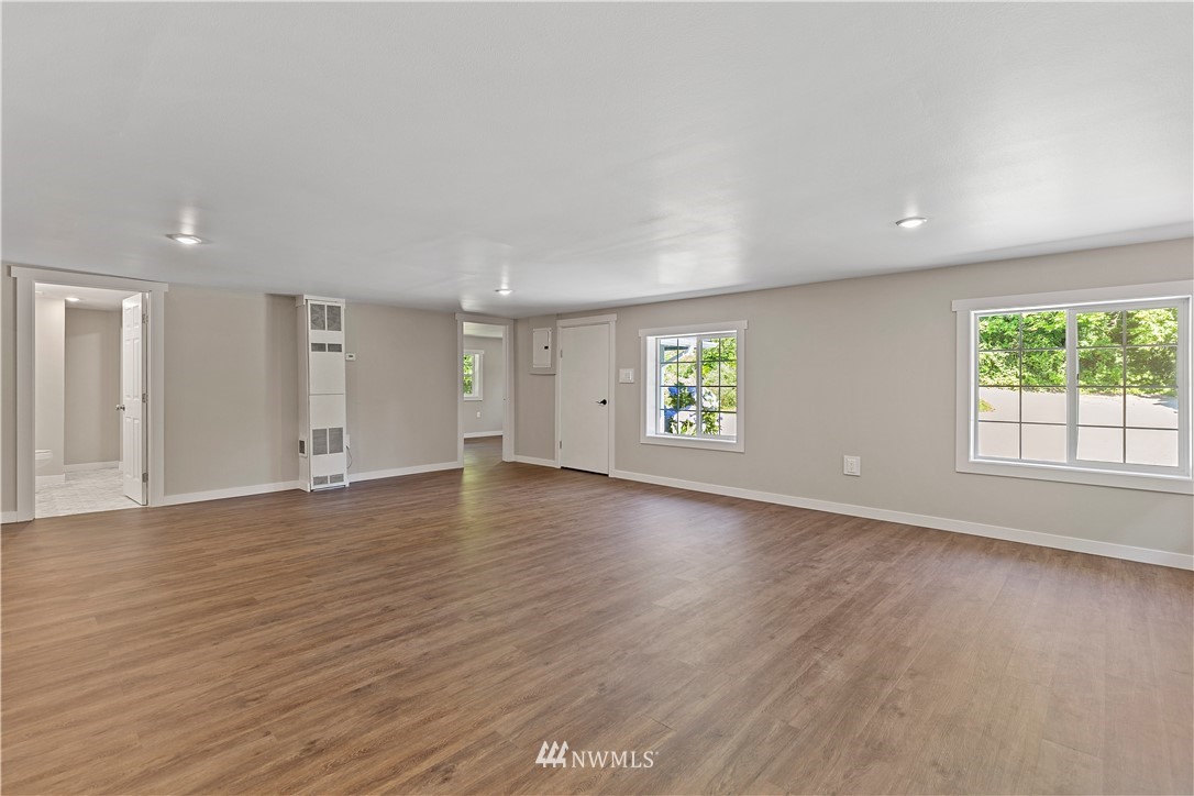17610 Blodgett Road Mount Vernon, WA 98274 - Photo 5 of 30 an empty room with wooden floor and windows