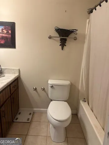 a bathroom with a toilet and a sink