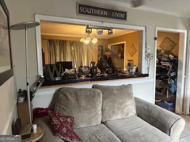 a living room with furniture a window and gym equipment