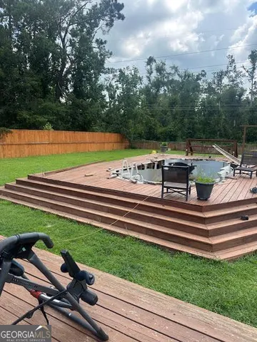 a view of a chairs and tables in the backyard