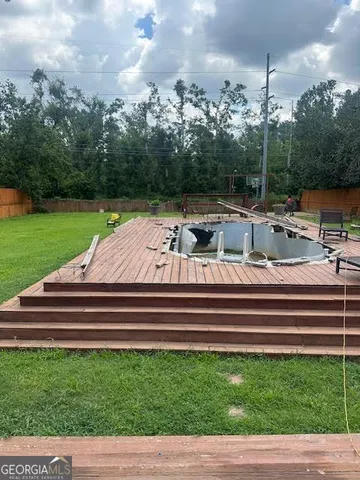 a view of swimming pool with a patio