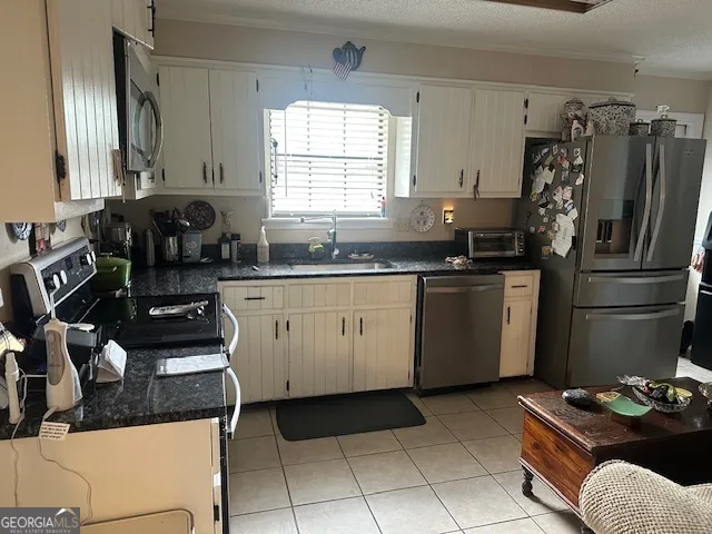 a kitchen with a sink stove and refrigerator