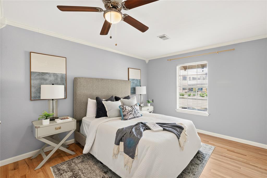 649 Peavy Road Dallas, TX 75218 - Photo 12 of 30 Hardwood flooring, crown molding, a ceiling fan with integrated lighting, a window with horizontal blinds, and a built-in closet with a sliding door