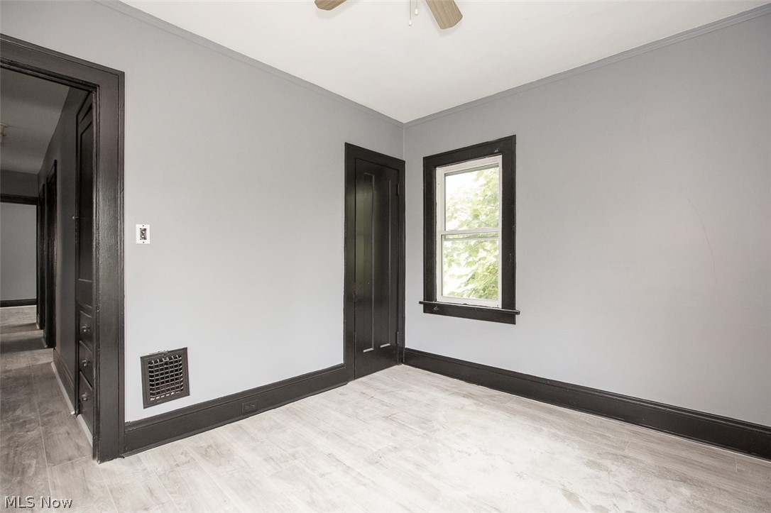 1868-1870 Lampson Road Cleveland, OH 44112 - Photo 18 of 36 Room featuring light-toned flooring, gray walls, and dark trim