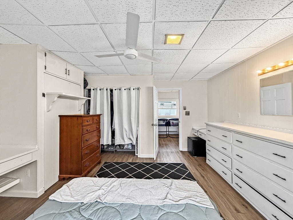 126 Beach Road Salisbury, MA 01952 - Photo 27 of 30 a bedroom with a bed and cabinets
