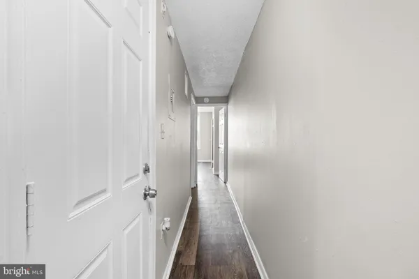 a view of a hallway with a white walls
