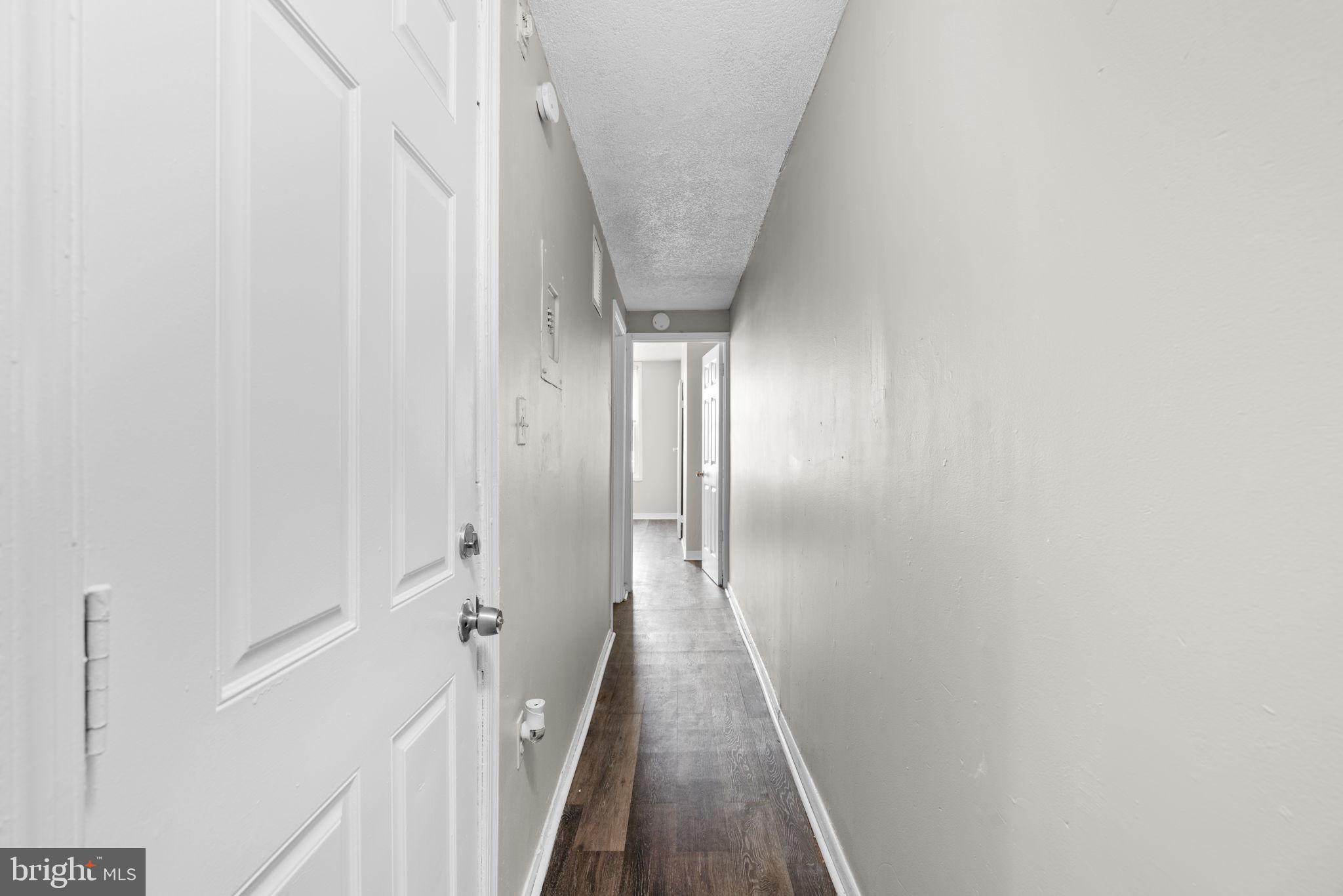 517 Mosher Street Baltimore, MD 21217 - Photo 2 of 45 a view of a hallway with a white walls