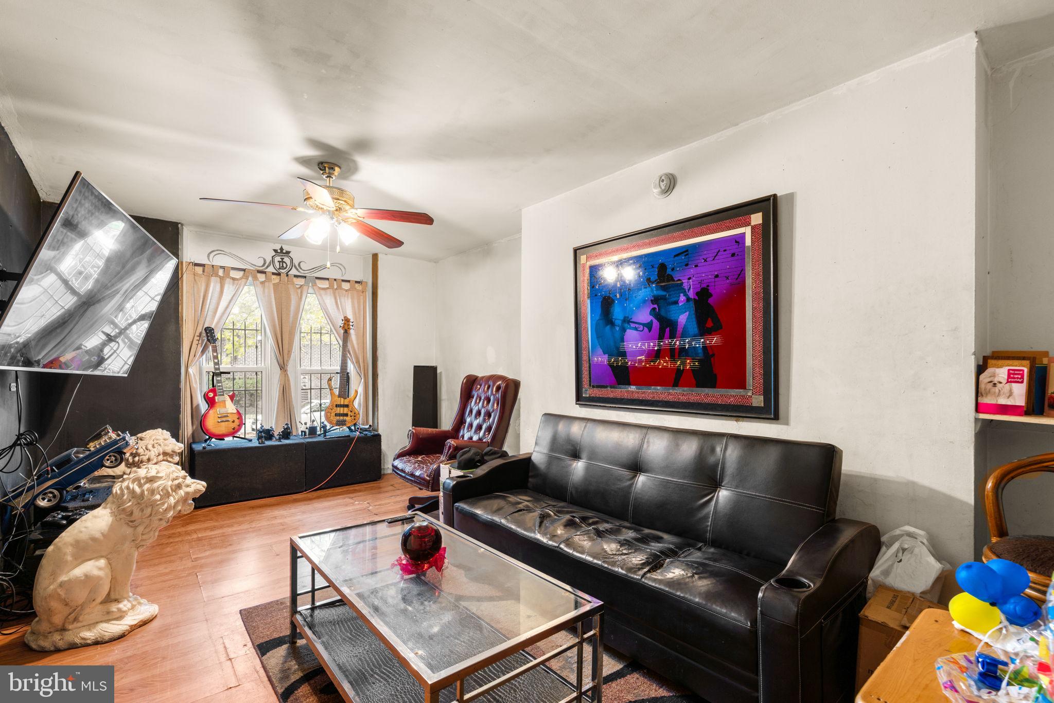 517 Mosher Street Baltimore, MD 21217 - Photo 35 of 45 a living room with furniture or couch and a flat screen tv