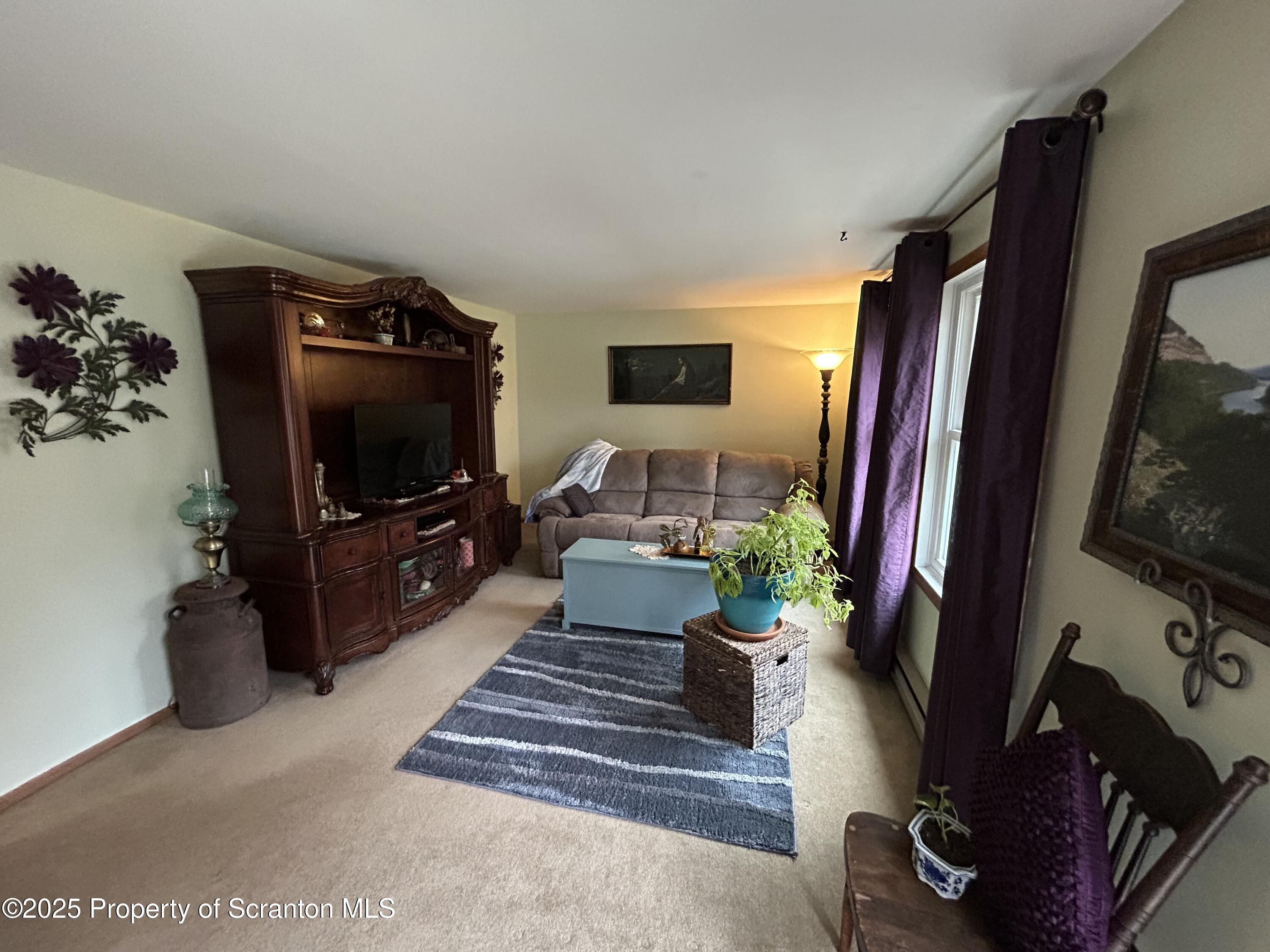 7 Hollow Crest Road Tunkhannock, PA 18657 - Photo 18 of 41 a living room with furniture and a flat screen tv